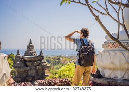 Young Man Tourist In Budhist Temple Brahma Vihara Arama Banjar Bali, Indonesia
