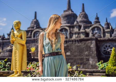 Young Woman Tourist In Budhist Temple Brahma Vihara Arama Banjar Bali, Indonesia