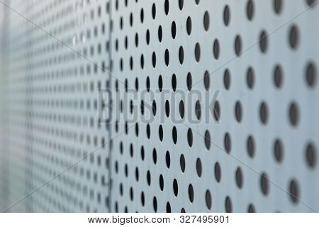 Angular View Of Metal Surface With Round Openings