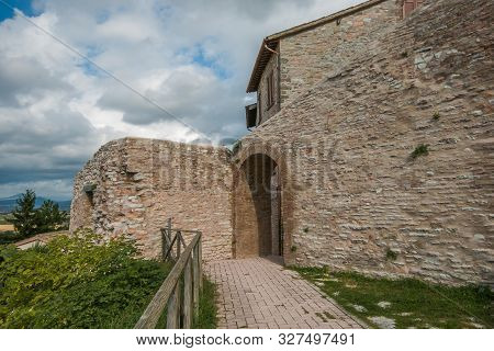 Fossato Di Vico, Italy - October 10, 2019: The Wall Of Old Fortress Of Fossa Di Vico Village In Umbr
