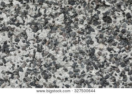 Close-up Of Underpoured Pavement With Grey Gravel