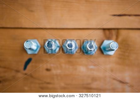 Set Of Metalware On The Wooden Background