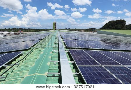Solar Pv Rooftop System With Facility Cloudy Sky Background