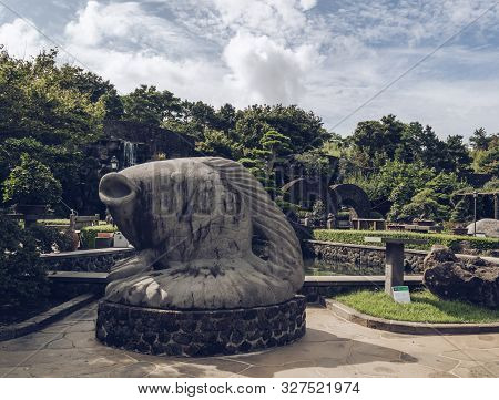 Jeju Island, South Korea, September 05, 2019: Stone Fish Sculpture Inside Of Spirited Garden With Be