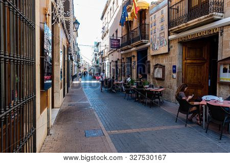 Denia, Valenciana, Spain - Sept 23 2019 : Streets Of Denia With Tourists Wandering Around.