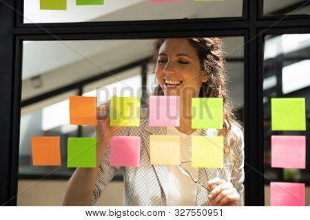 Businesswoman Writes Creates Personal Tasks List On Sticky Notes