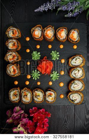 Hotto Set Of Sushi Rolls On Black Stone