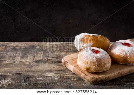 Hanukkah Sufganiyot On White Background. Traditional Jewish Donuts For Hanukkah. Copy Space