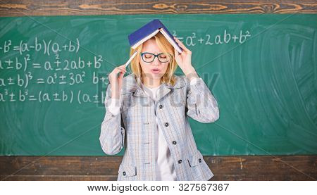Woman Teacher With Book As Roof On Head. Memorizing Method. Train Memory Every Day. Effective Method