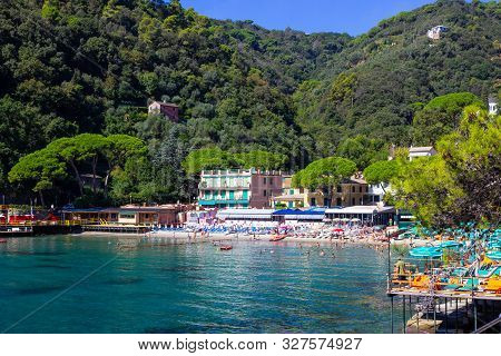 The Sand Beach Known As Paraggi Near Portofino In Genoa On A Blue Sky And Sea Background