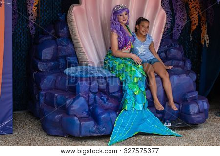 Orlando, Florida. September 21, 2019. Mermaid With Little Gir At Seaworld 105