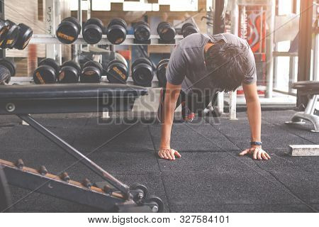 Sport Man Doing Push Ups Exercise In Gym. Workout Concept. Fitness Concept