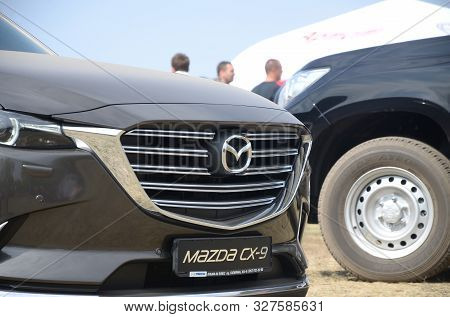 Kharkov, Ukraine - August 31, 2019: Mazda Logo Badge And Car Grill On Mazda Cx-9 Luxury Vehicle. Maz