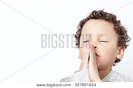 Little Boy Praying To God Stock Image With Hands Held Together With Closed Eyes  Stock Photo