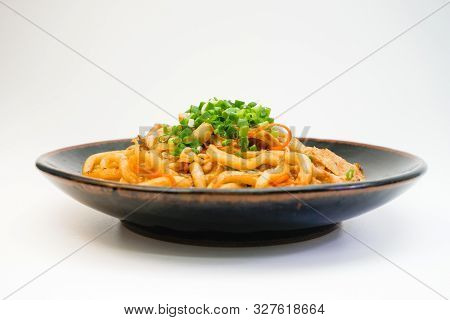 Plate Of Fried Noodle With Pork Meat On White Background. Delicious Asian Spaghetti.