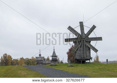 Karelia, Russia - August 27, 2019: Sunset Landscape With View Of The Transfiguration Church And Farm