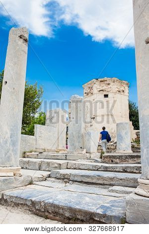 Athens, Greece - April, 2018: Tourist Visiting The Tower Of The Winds Or The Horologion Of Androniko