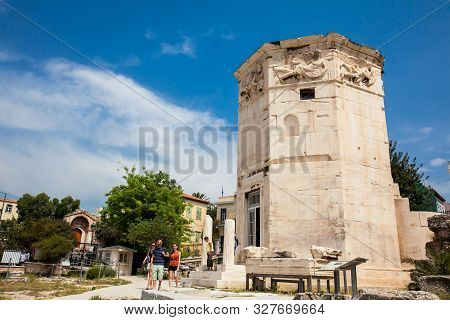 Athens, Greece - April, 2018: Tourists Visiting The Tower Of The Winds Or The Horologion Of Andronik
