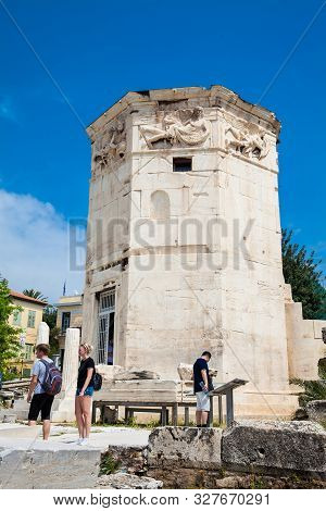 Athens, Greece - April, 2018: Tourists Visiting The Tower Of The Winds Or The Horologion Of Andronik
