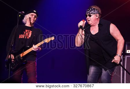 HUNTINGTON - OCT 10: Mike Reno (R) and Paul Dean of Loverboy performs in concert at the Paramount on October 10, 2019 in Huntington, New York.