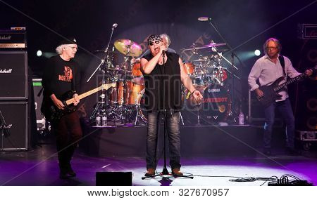 HUNTINGTON - OCT 10: (L-R) Paul Dean, Mike Reno, Matt Frenette and Ken Sinnaveve of Loverboy perform in concert at the Paramount on October 10, 2019 in Huntington, New York.