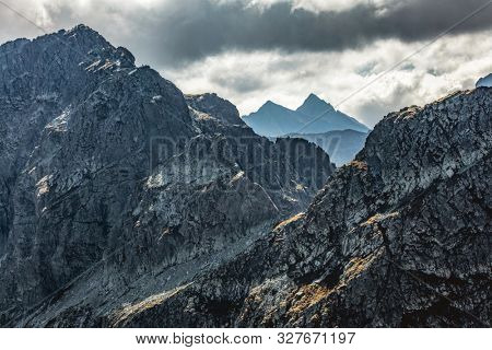 High mountain peaks and stormy clouds. Tatra Mountains in Poland. View from Koscielec peak