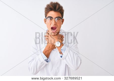 Young handsome sciencist man wearing glasses and coat over isolated white background shouting suffocate because painful strangle. Health problem. Asphyxiate and suicide concept.