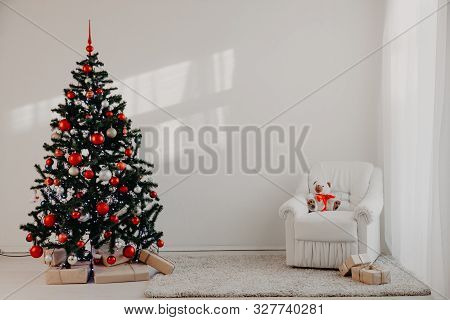 Christmas Tree In A White Room For Christmas With Gifts