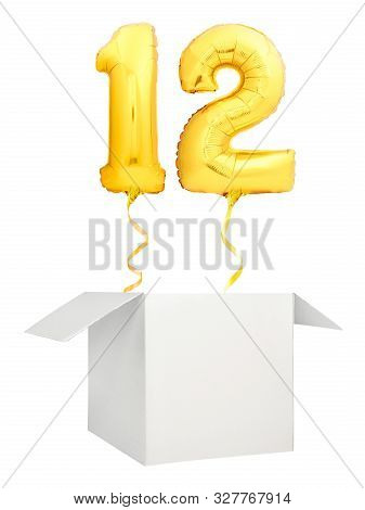 Golden Number Twelve Balloon Flying Out Of Blank White Box Isolated On White Background