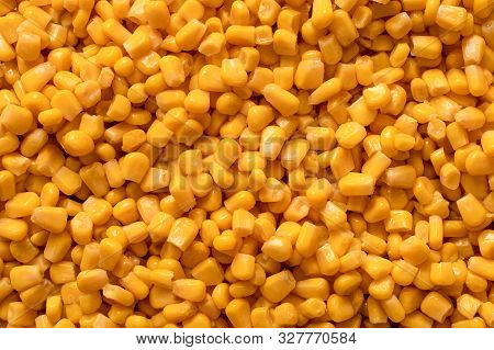 Background Of Canned Sweet Corn. Top View.