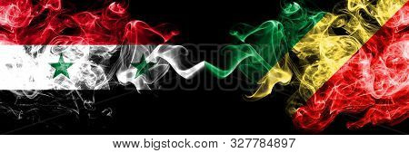 Syria Vs Congo, Congolese Smoke Flags Placed Side By Side. Thick Colored Silky Smoke Flags Of Syrian