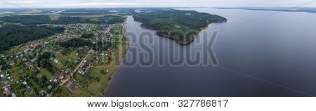 Aerial view of the Votkinsk Reservoir (on the river of Kama) and village Stepanovo on its coast. Perm Krai, Russia