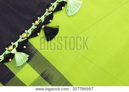Crochet, Tassel Fashion Designing Works On Black Cloth Border Saree With Checks.