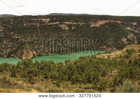 Swamp Surrounded By Mountains And Colorful Vegetation In El Molinar, Casas De Ves, Spain. Crystal Cl