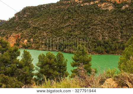 Swamp Surrounded By Mountains And Colorful Vegetation In El Molinar, Casas De Ves, Spain. Crystal Cl