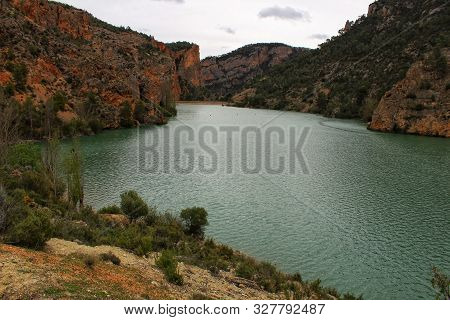 Swamp Surrounded By Mountains And Colorful Vegetation In El Molinar, Casas De Ves, Spain. Crystal Cl