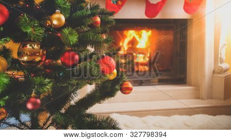 Toned Christmas Background With Firepalce And Christmas Tree In Living Room