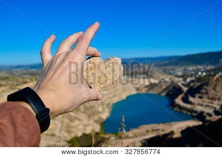 Heart Shaped Blue Quarry Lake. A Stone In The Shape Of A Heart. Kadykovsky Quarry, Balaklava, Crimea