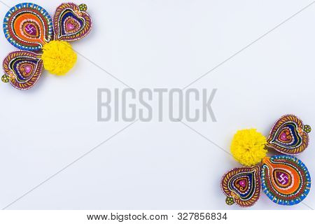 Indian Festival Diwali, Diya Oil Lamps Lit On Colorful Rangoli. Hindu Traditional. Happy Deepavali.