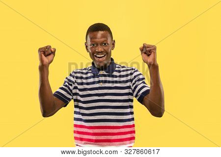 Wow I Won. Young African-american Man Isolated On Yellow Studio Background, Facial Expression. Beaut