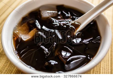 traditional Taiwanese snacks of mesona black herbal tea in a bowl