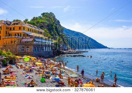 Camogli, Italy - September 15, 2019: People Resting At Beach At Camogli On Sunny Summer Day, Liguria