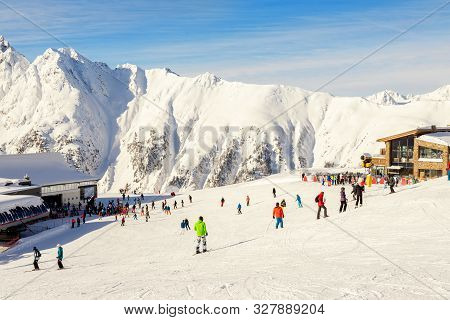 Many Skiers And Snowboarders Riding Over Idalp Downhill Plato At Austrian Alipine Ischgl Resort On B