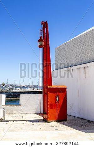 Cascais - August 14, 2019: View Of An Old Red Lighthouse Beacon, An Exhibit Of The Lighthouse Museum
