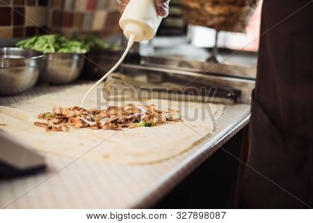 Cooking Fajitos In The Cafe. Cooking Shawarma In Pita In The Kitchen. Wrap Chicken, Carrots, Lettuce