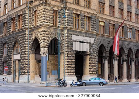 Cityscape With Street And Austrian Flag In Vienna