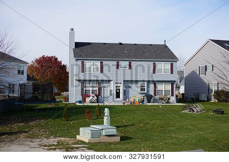 Joliet, Illinois / United States - December 2, 2017: A Small Two-story Single Family Tract Home In T