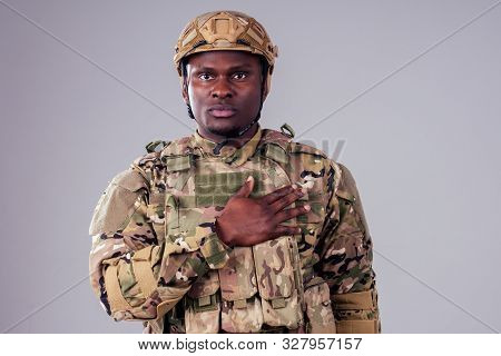 African American Soldier With Folded Arms Standing In White Studio