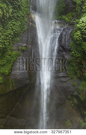 Sekumpul Waterfalls In Bali, Indonesia.waterfall In Green Forest. Triple Tropical Waterfall Sekumpul