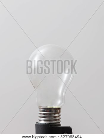 Light Bulb Without Filament Over White Background
